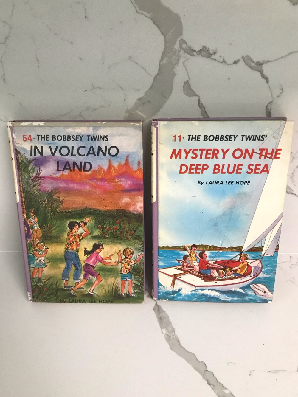 Vintage The Bobbsey Twins: In Volcano Land 54 & Mystery on the Deep Blue Sea 11